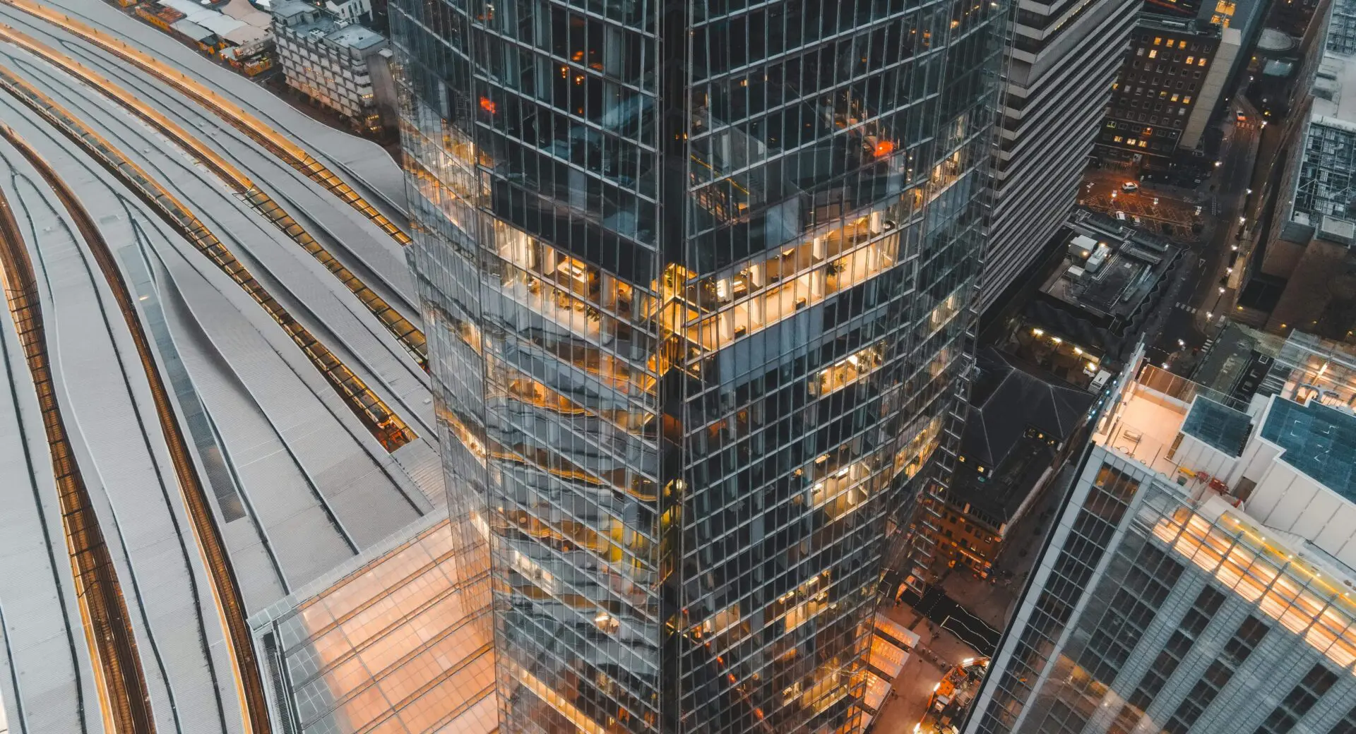 scenery tall building in london ran by facilities managers with train tracks in background