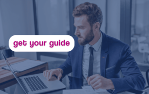 Text on the screen reads "Get your guide" This image relates to our downloadable guide on finance salaries in 2024.