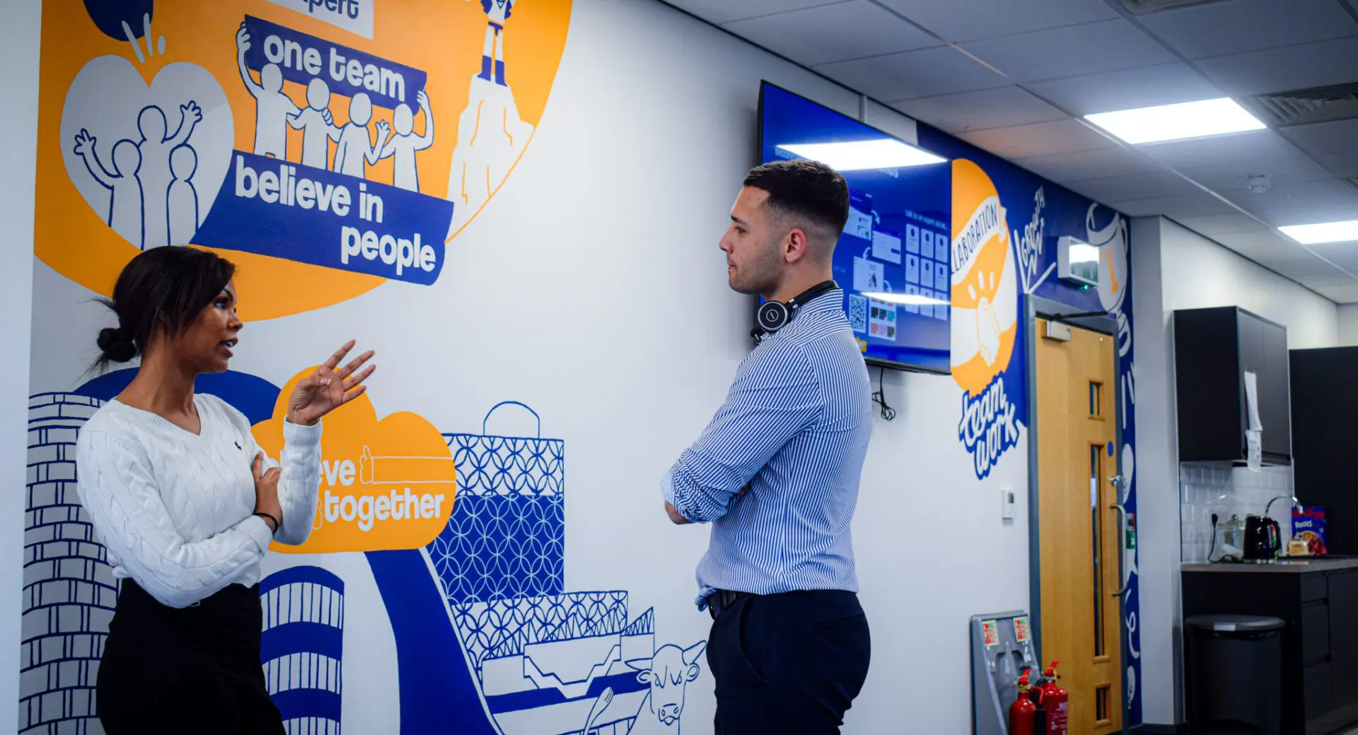 A diverse group of Boden Group recruitment consultants in Birmingham HQ, building relationships and fostering a positive team dynamic.